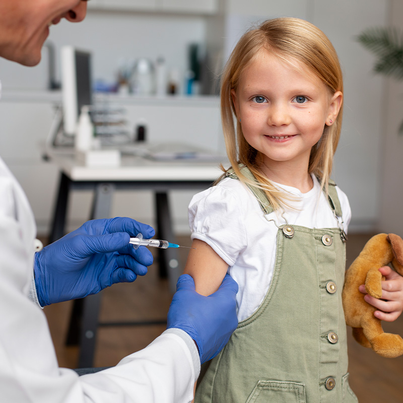 Young girl getting a vaccine shot